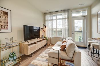 Luxury wood-style flooring in kitchen and living rooms